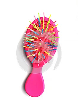 Children`s bright pink hair brush