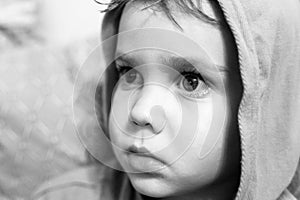 Children`s candid emotions on the child`s face. portrait of a little boy with an expression of intense surprise or scared on his