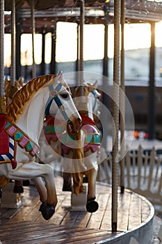 Children`s carousel with horses outdoor