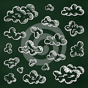 Children\'s Chalk Drawn Sketch. Set of Design Elements White Clouds Isolated on Chalkboard Backdrop