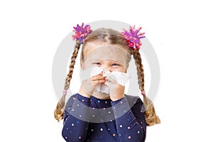 Children`s cold. The little girl has a runny nose photo