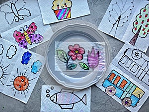 Children`s craft, magic trick, image appears in a plate of water, child art.