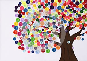 Children's craft of a tree made of buttons photo
