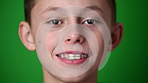 Children's dental plate, the boy wears a plate for aligning teeth.