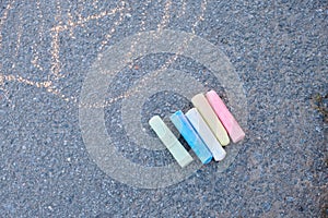 children's drawing on the road, colored chalk crayons