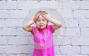 Children`s emotions. Beautiful girl shows how much she is surprised