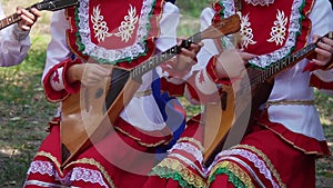 Children`s Ensemble in Embroided Costumes Playing Music on Balalaika, Traditional Russian Musical Instrument