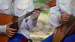 Children`s Ensemble in Embroided Costumes Playing Music on Balalaika, Traditional Russian Musical Instrument