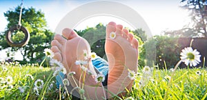 Children's feet in the grass