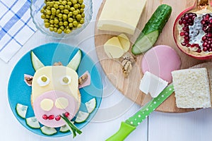 Children`s fun food.Sandwich in the form of a cow for kids breakfast.Step-by-step recipe for cooking dishes for menu