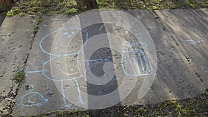 Children`s funny drawing on the street, on the path