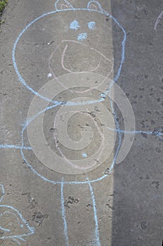 Children`s funny drawing on the street, on the path