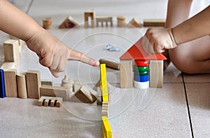 Children's hand and building block