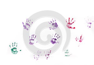 Children's hand prints on white wall