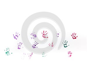 Children's hand prints on white wall