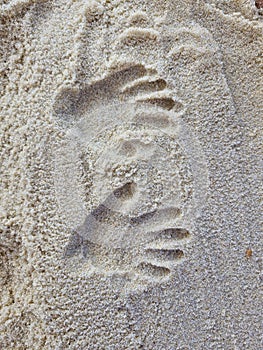 Children handprints on the sand