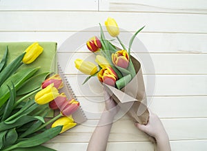 Children`s hands collect a bouquet as a gift. A gift for mom.