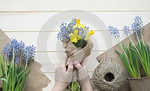 Children`s hands collect a bouquet as a gift. A gift for mom.