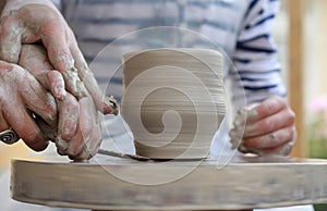 Children's hands creating new vase