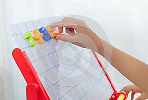 Children`s hands playing toys