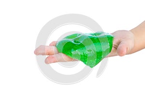 Children`s hands wrinkle, stretch, manipulate with a green transparent slime. Trend for children and youth. Isolate