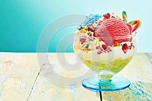 Children's ice cream sundae with sweets in glass