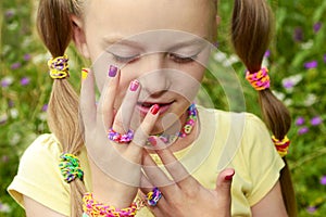 Children`s multicolored manicure.