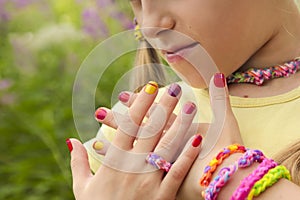 Children`s multicolored manicure.