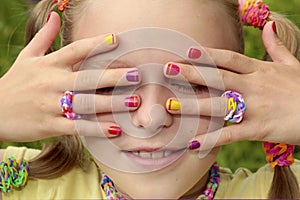 Children`s multicolored manicure.
