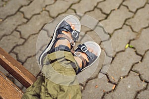 Children`s orthopedic shoes on the boy`s feet