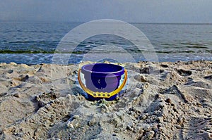 Children`s pail on the beach