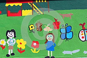 Children's painting on a wall.