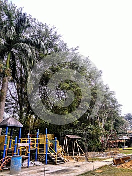 A children`s park has playing children leisure time.