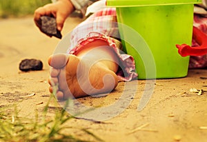 Children's pinches on warm sand photo