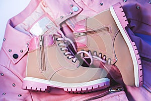 Children`s pink jacket and boots.