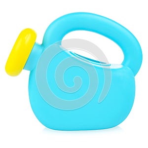 Children's plastic watering can for playing in the sandbox or in the garden. Blue watering can isolated on a white