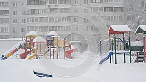 Children`s play complex near house during blizzards