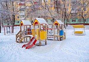 Children's play ground in snow on winter season