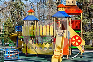 Children`s playground closed and wrapped in alarm caution tape for global coronavirus quarantine