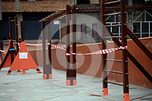 Children`s playground closed and wrapped in alarm caution tape for global coronavirus quarantine.No children on playgrounds.
