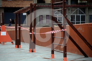 Children`s playground closed and wrapped in alarm caution tape for global coronavirus quarantine.No children on playgrounds.