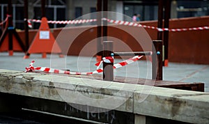 Children`s playground closed and wrapped in alarm caution tape for global coronavirus quarantine.No children on playgrounds.