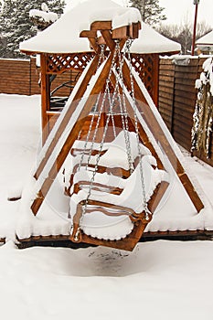Children`s playground covered with snow