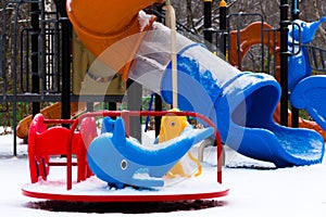 Children`s playground covered with snow. Closeup