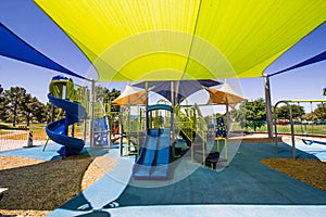 Children`s Playground Equipment Covered By Colorful Canopies