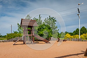 Children`s playground equipped with wooden slides.