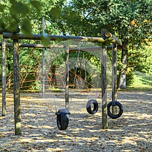 Children`s playground in Germany with a tire swing