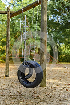 Children`s playground in Germany with a tire swing