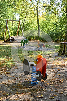 Children`s playground in Germany with various rocking swings and a zip-line