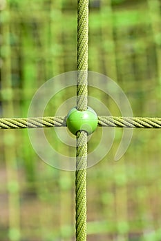 Children`s playground with green balls and cords